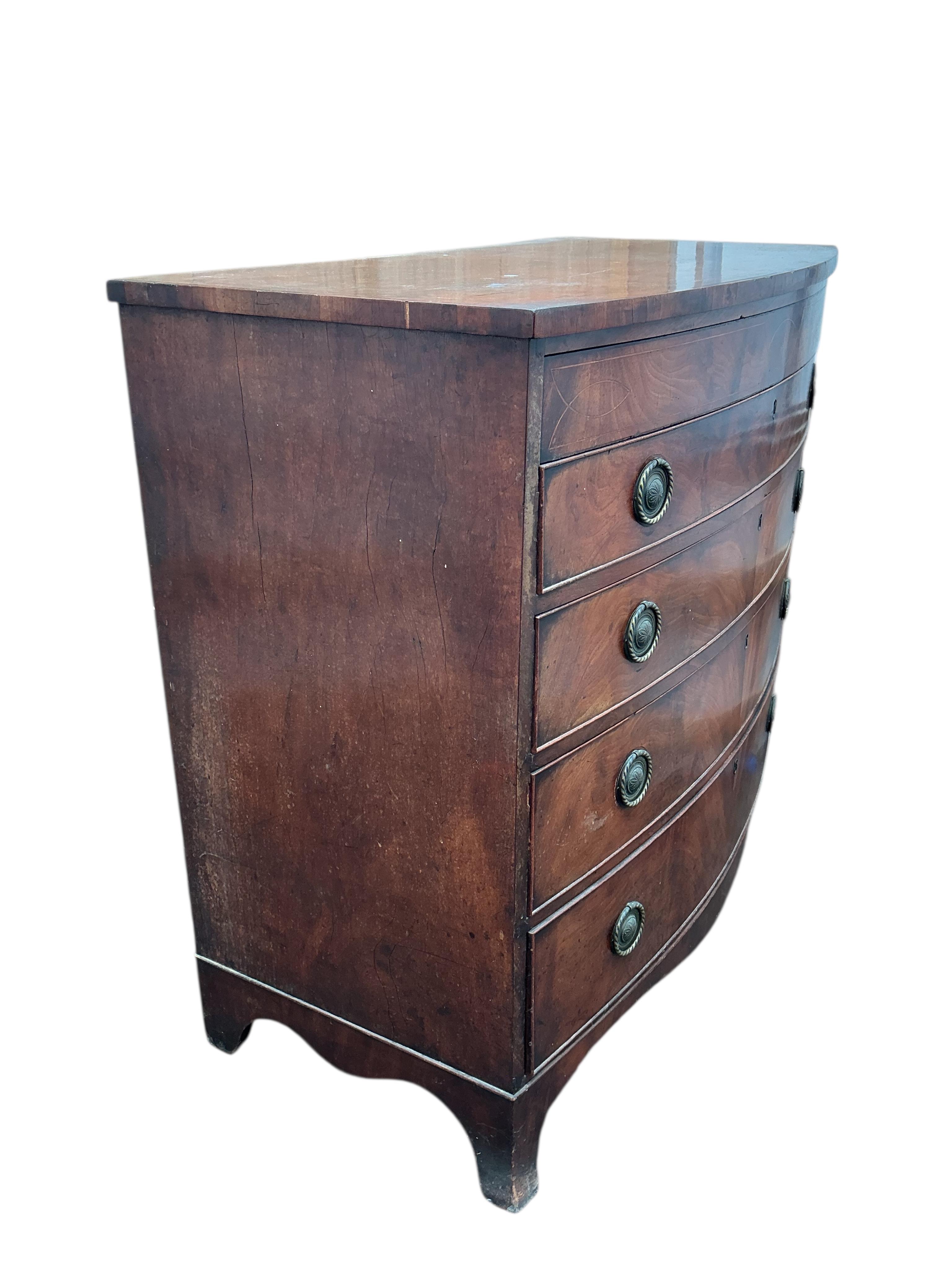 A Regency inlaid mahogany bowfront chest of drawers, width 106cm, depth 56cm, height 100cm